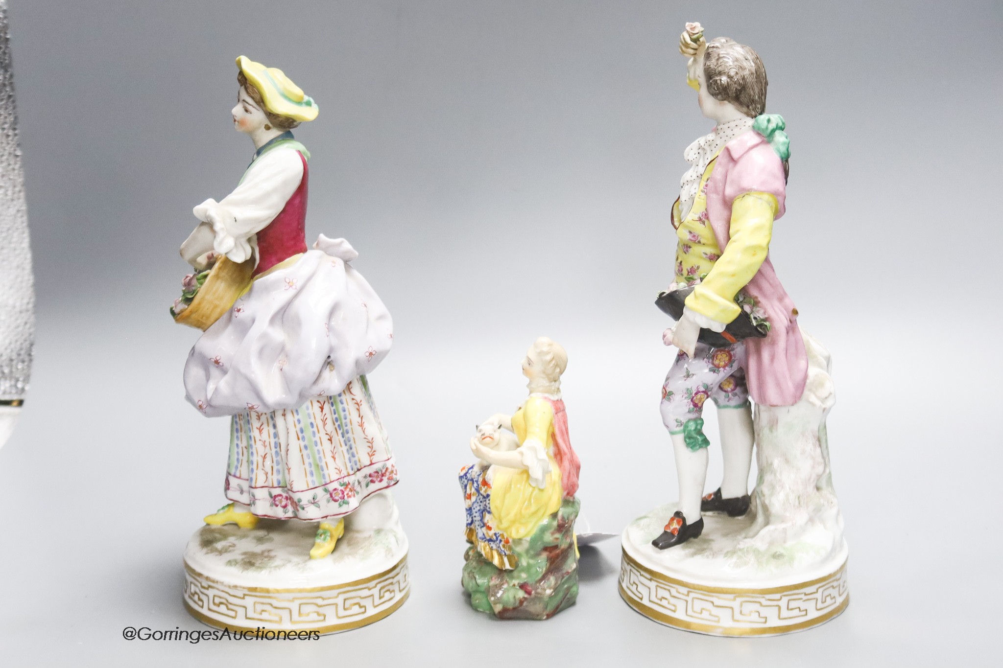 A pair of Continental porcelain figures and smaller, English figure